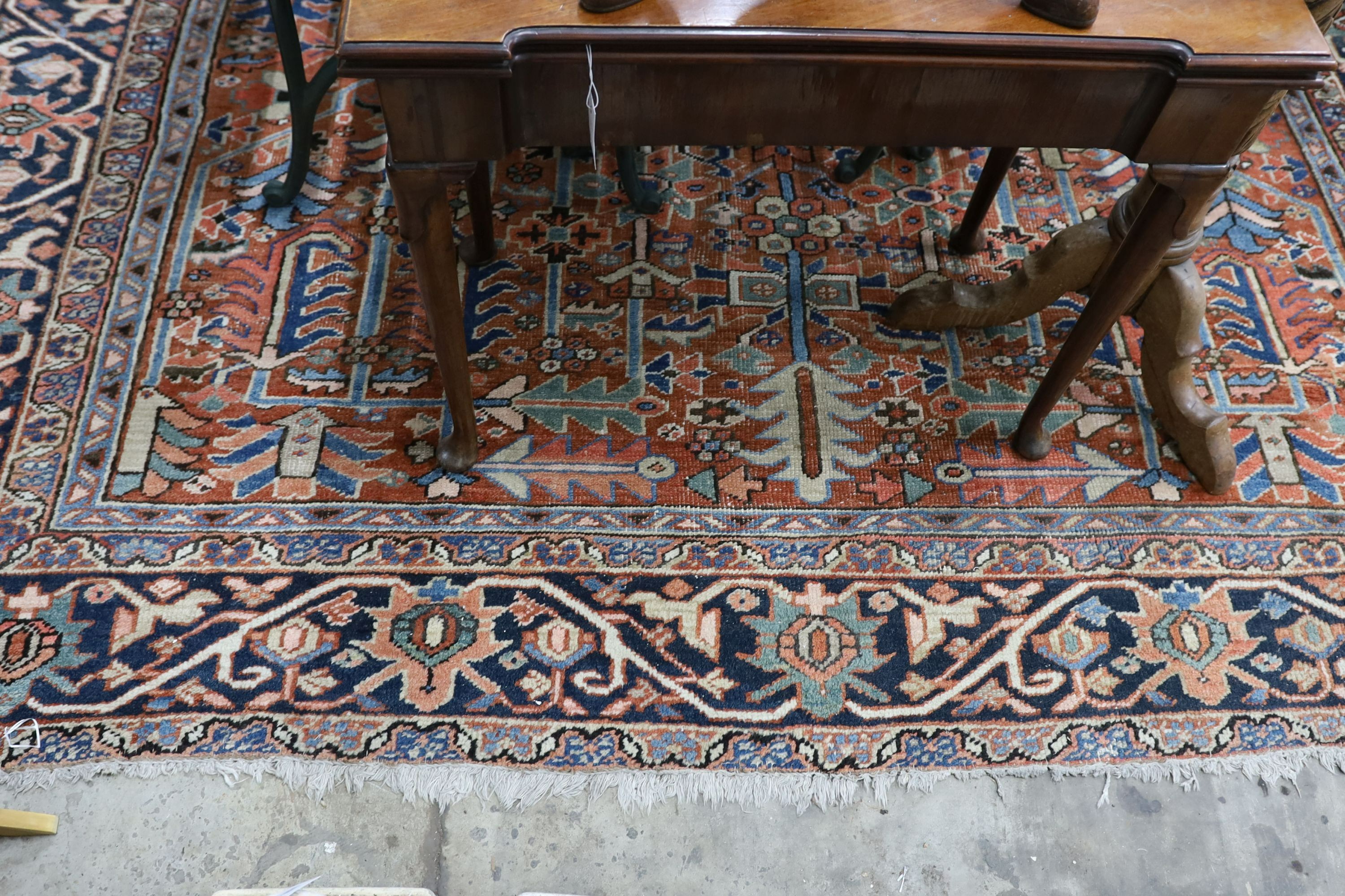 A Caucasian red ground carpet, 390 x 285cm